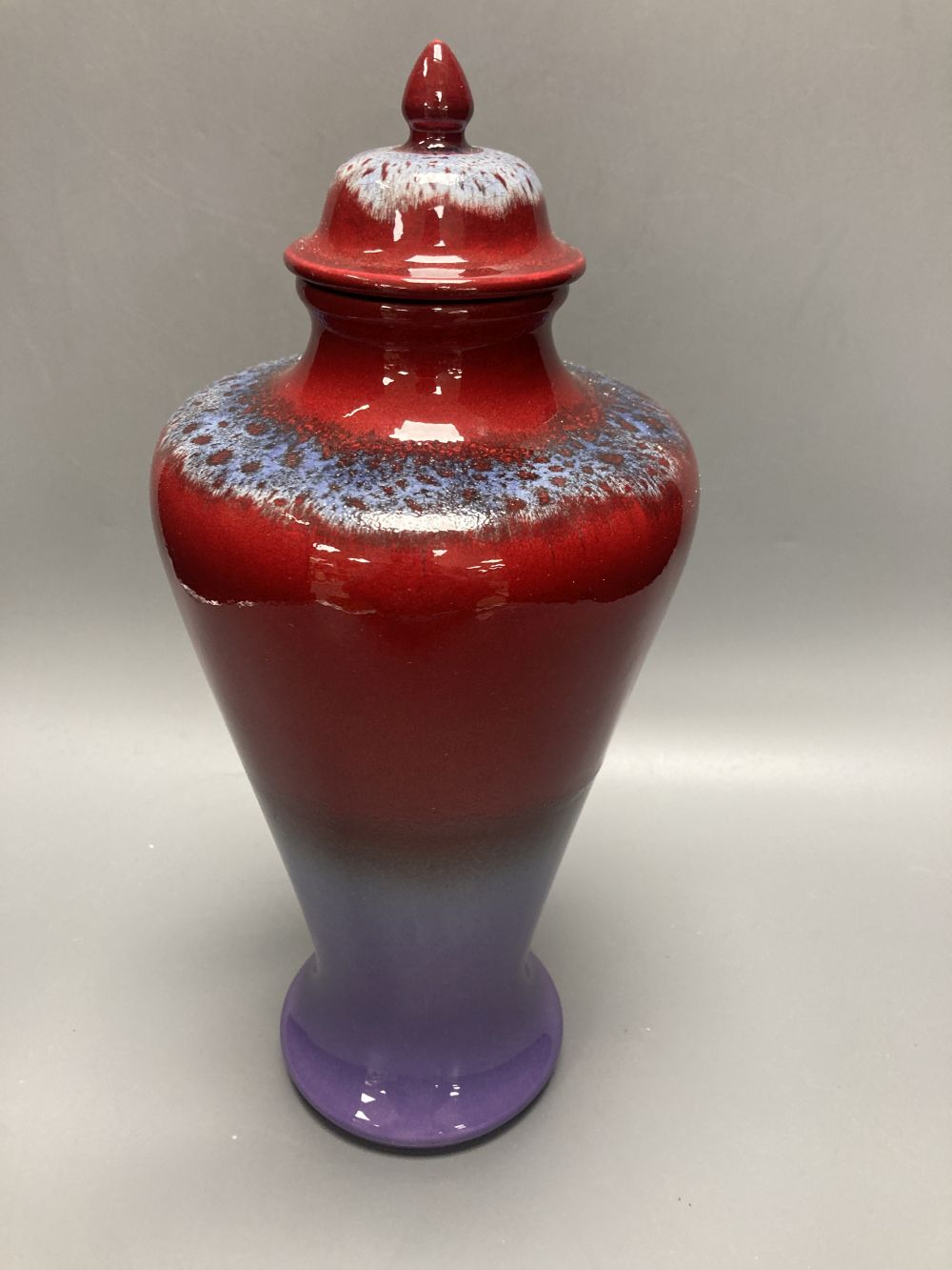 A Poole pottery flambe vase and cover, inspired by Ruskin and made for the V & A Arts and Crafts Exhibition 2005, height overall 31cm
